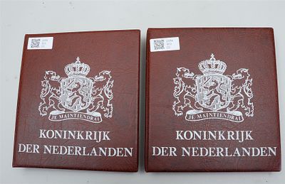 Collection of guilders from the 1940s through the 1990s, including silver specimens, divided 