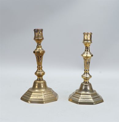 Two candlesticks decorated with garlands, with tops in the shape of an open flower. France 