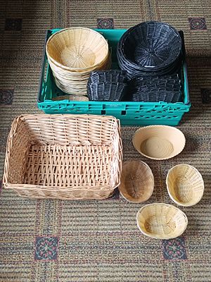 A Collection of Woven Baskets and a Musgrave Plastic Utility Crate