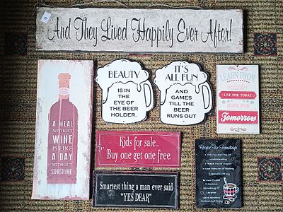 A Collection of Eight Contemporary Decorative Wall Signs and Plaques