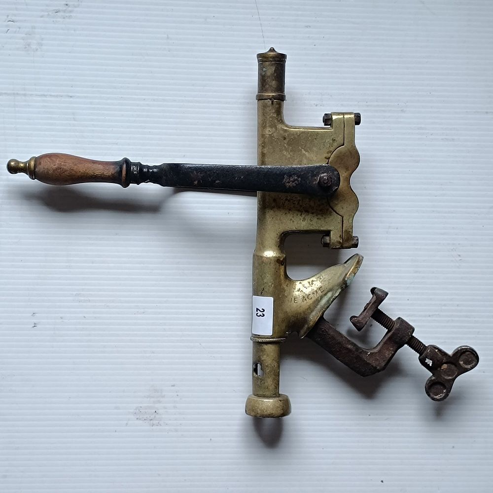 An Antique 'The Acme' Brass Bar Mounting Automatic Corkscrew