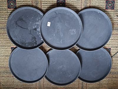 A Set of Six Carlisle Griplite Round Black Serving Trays