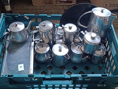 A Collection of Rogers Insilco Mid Century Modern Stainless Steel Tea and Coffee Pots with Tray