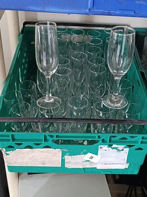 A Group of Clear Glass Drinking Glasses, including Tumblers and Champagne Flutes