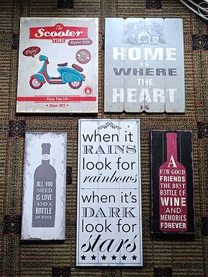 A Group of Five Contemporary Rustic and Vintage-Inspired Decorative Wall Plaques