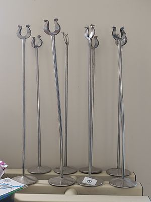 A Group of Seven Update International Stainless Steel Menu/Card Stands