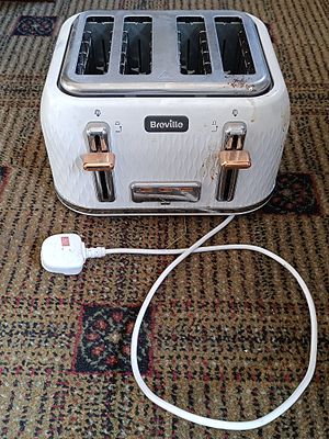 A Breville Curve White and Rose Gold Four-Slice Toaster