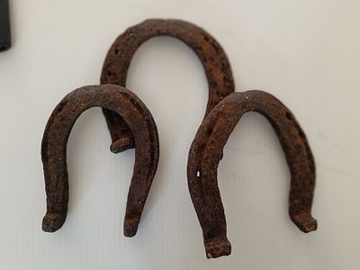 Three Vintage Rustic Iron or Steel Horseshoes