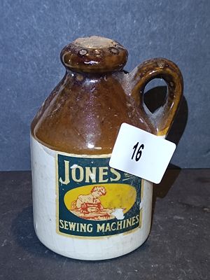 A Vintage Two-Tone Stoneware Advertising Flagon for Jones Sewing Machines