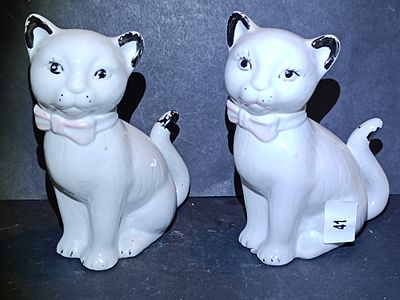 A Pair of Vintage Stylized White Glazed Ceramic Cat Figurines