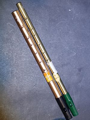 A Pair of Tin Whistles, including a Feadóg Irish Brass Whistle