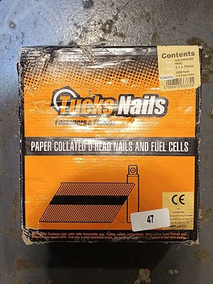 A Box of Tucks Nails Paper Collated D-Head Nails and Fuel Cells