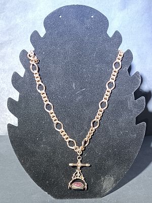 A Gold-Toned Chain Necklace with T-Bar and Swivel Fob Seal