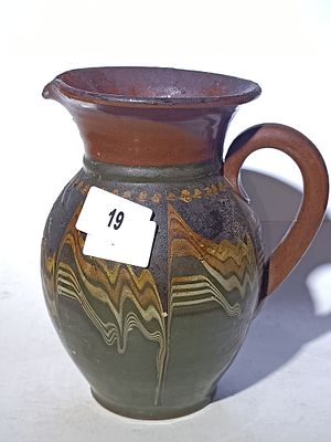 A Glazed Earthenware Slip-Trailed Pitcher
