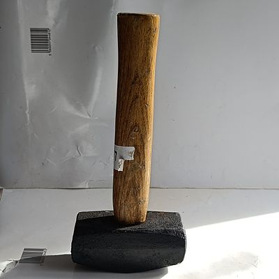 A Steel-Headed Club Hammer with Turned Wooden Handle