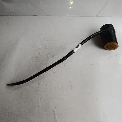 A Carved and Lacquered Wooden Implement with Long Stem