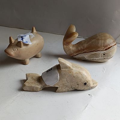 A Trio of Carved Marble and Stone Animal Figurines