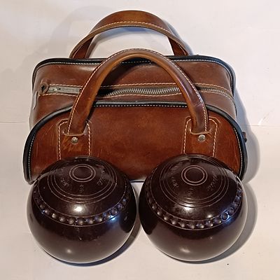 A Set of Henselite Super-Grip Lawn Bowls and Leather Carrying Bag