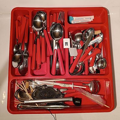 An Assortment of Red Plastic-Handled Stainless Steel Flatware and Kitchen Utensils in a Red 