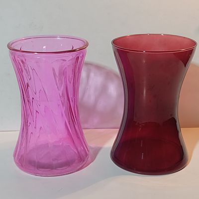 A Pair of Glass Nigella Style Gathering Vases in Pink Swirl and Ruby Red