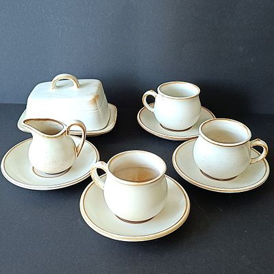 A 10-Piece Set of Speckled Stoneware Tableware in the Style of Mikasa Stone Manor