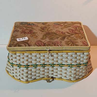 A Vintage Woven Wicker and Plastic Sewing Basket with Tapestry Lid
