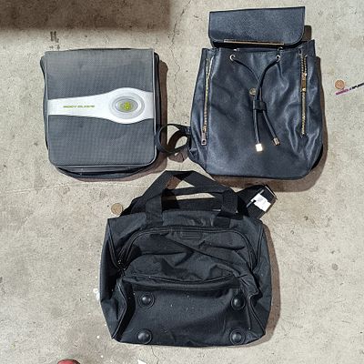 A Trio of Assorted Bags and Cases Including Body Glove and Attributed Huggies Styles