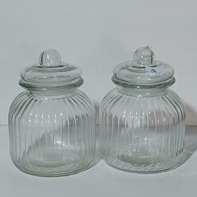 A Pair of Ribbed Clear Glass Apothecary Storage Jars with Domed Lids