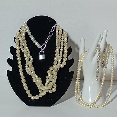 A Trio of Contemporary Simulated Pearl Necklaces Including a Padlock Pendant Statement Piece