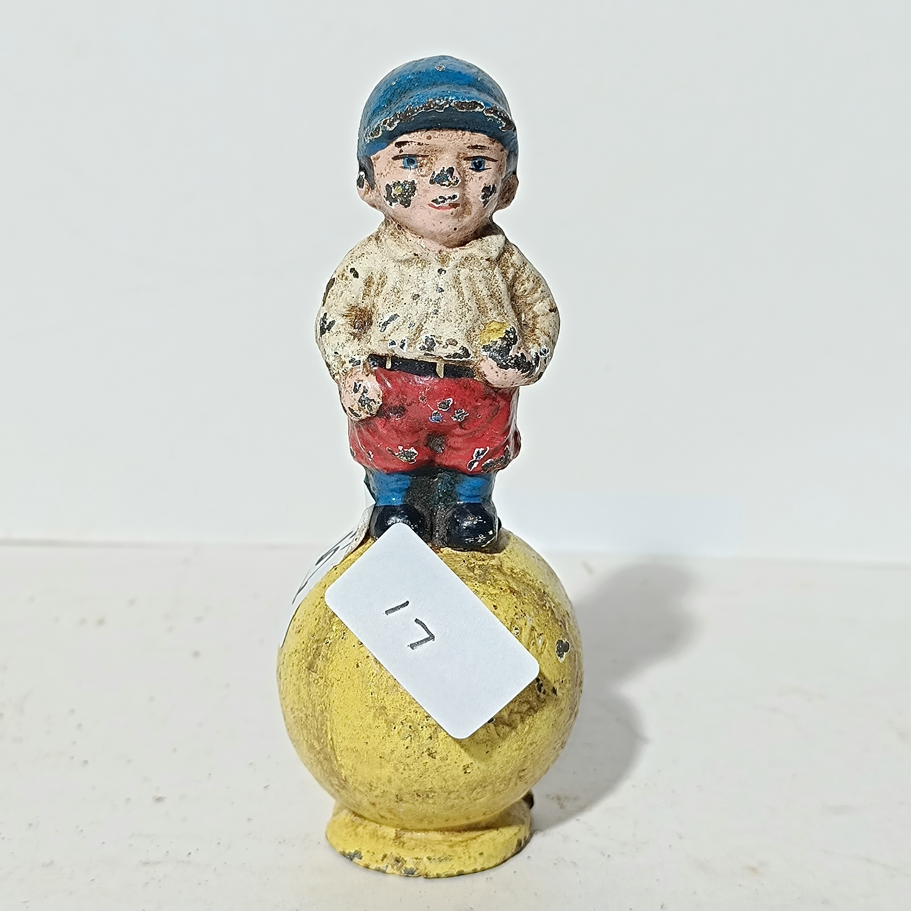 Painted Cast Iron Boy on Ball Still Bank