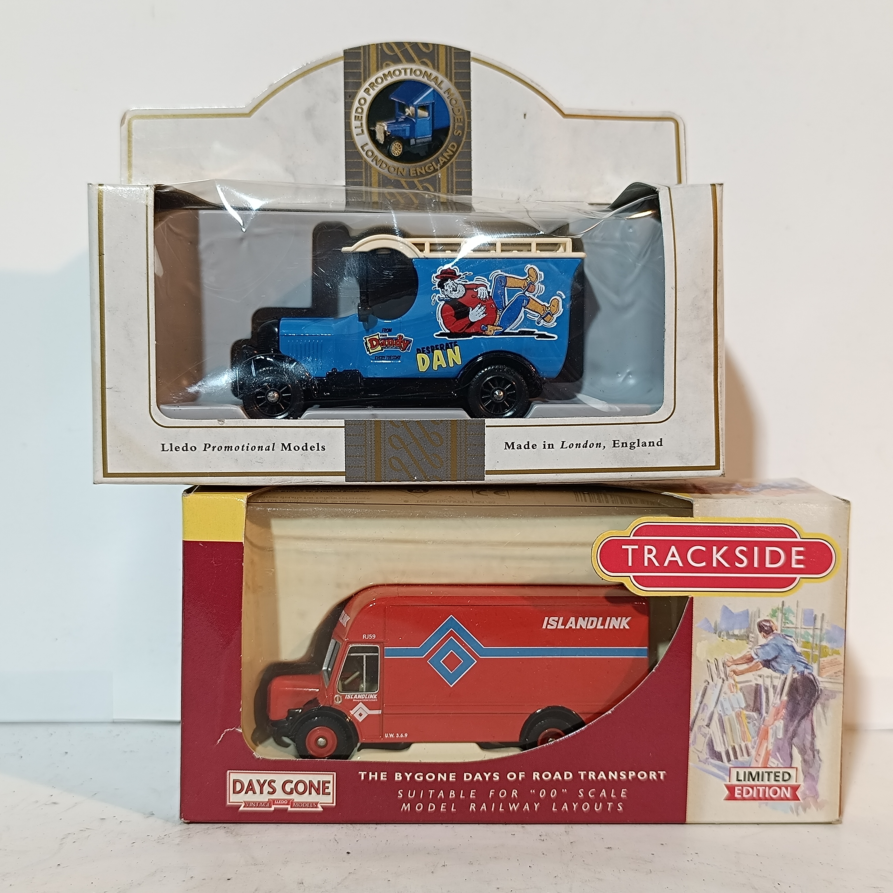 Two Boxed Lledo Die-Cast Promotional Model Vans Including Desperate Dan and Islandlink