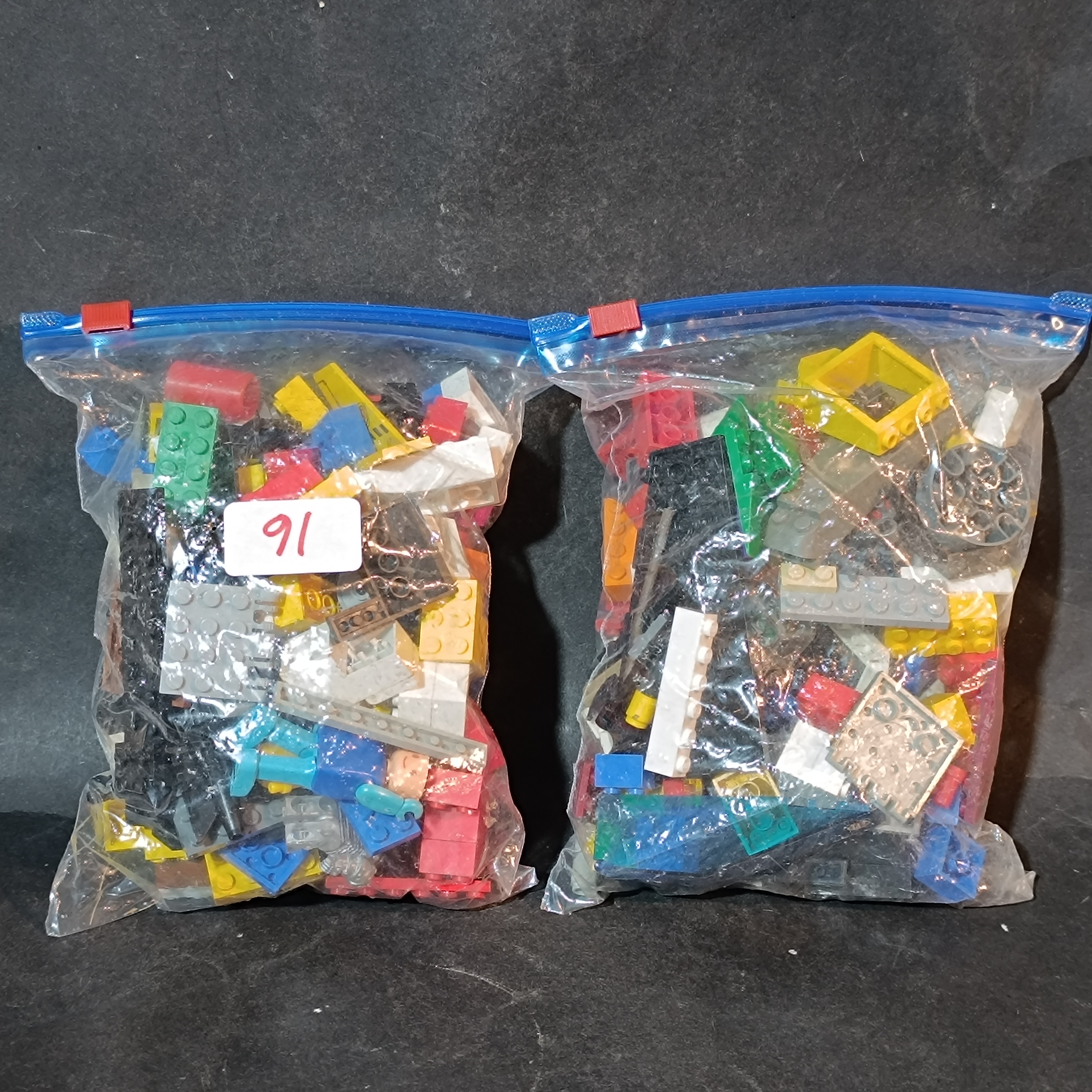 An Assortment of Loose Plastic Building Blocks and Components