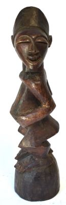 Unusual Antique Songye Figure. Head turned abstractly to the left, Crisp and fine carving. 