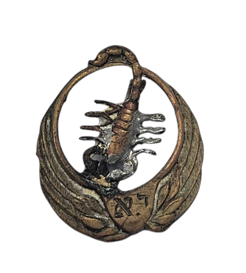 Early pin with Tayeset 105 symbol (scorpion), with Jonathan Etkes's initials. 
The Tayeset 