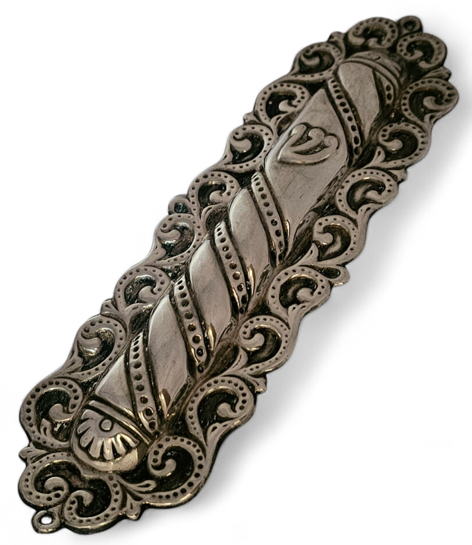 Sterling silver mezuza. 
Marked. 
Weight: 43.65g. 
63mm x 50mm.