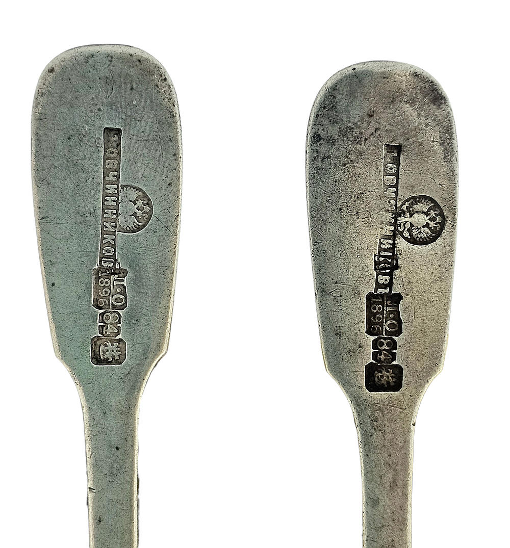 A pair of monogrammed Russian silver spoons by the famous Pavel Ovchinnikov (renowned Russian 