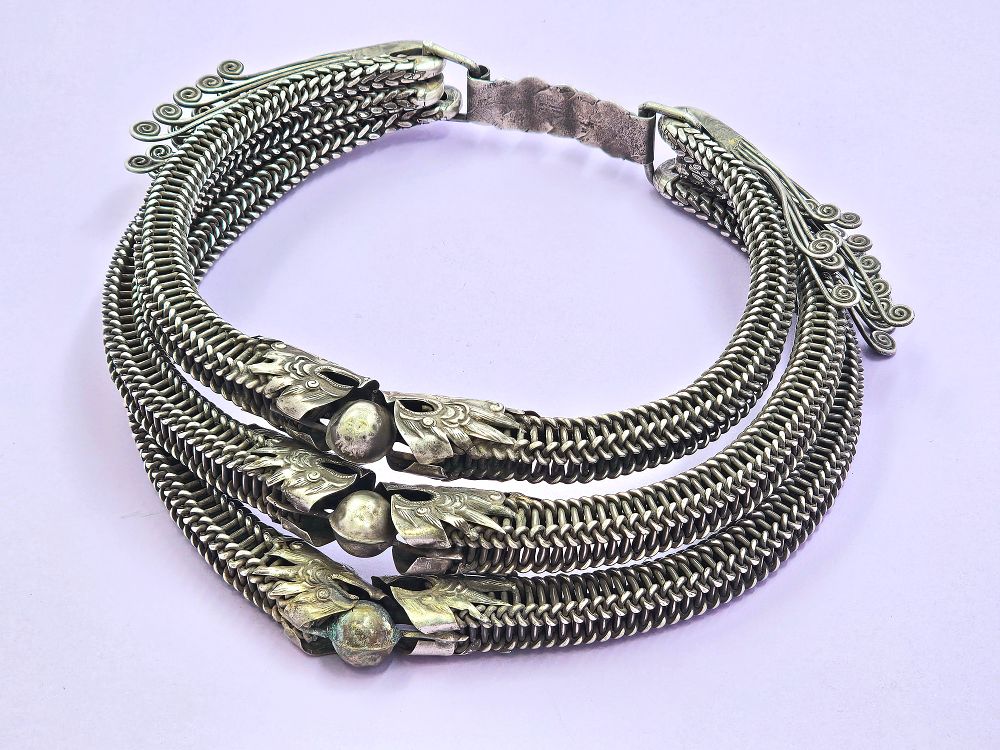 Show stopper tribal necklace with links and dragon embellishments at center. 
China-Tibet. 