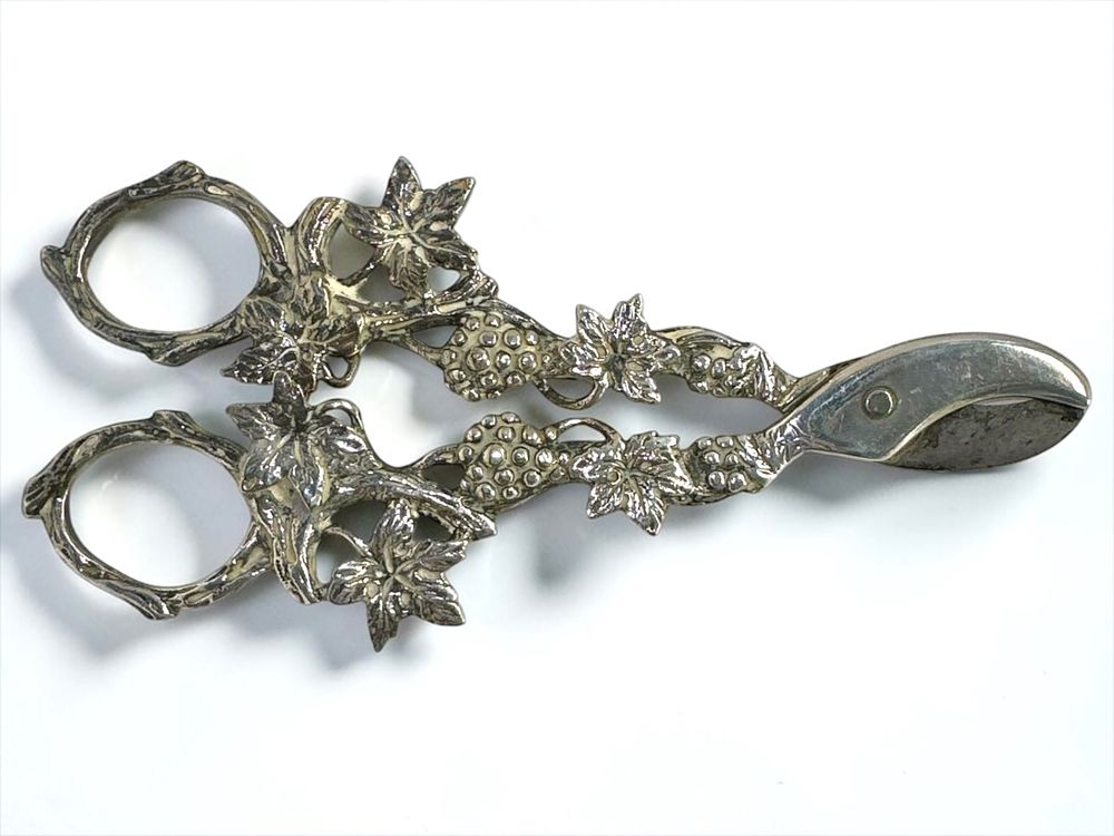 Beautiful, ornate grape shears, with grapevine motif throughout, even on the handles.
