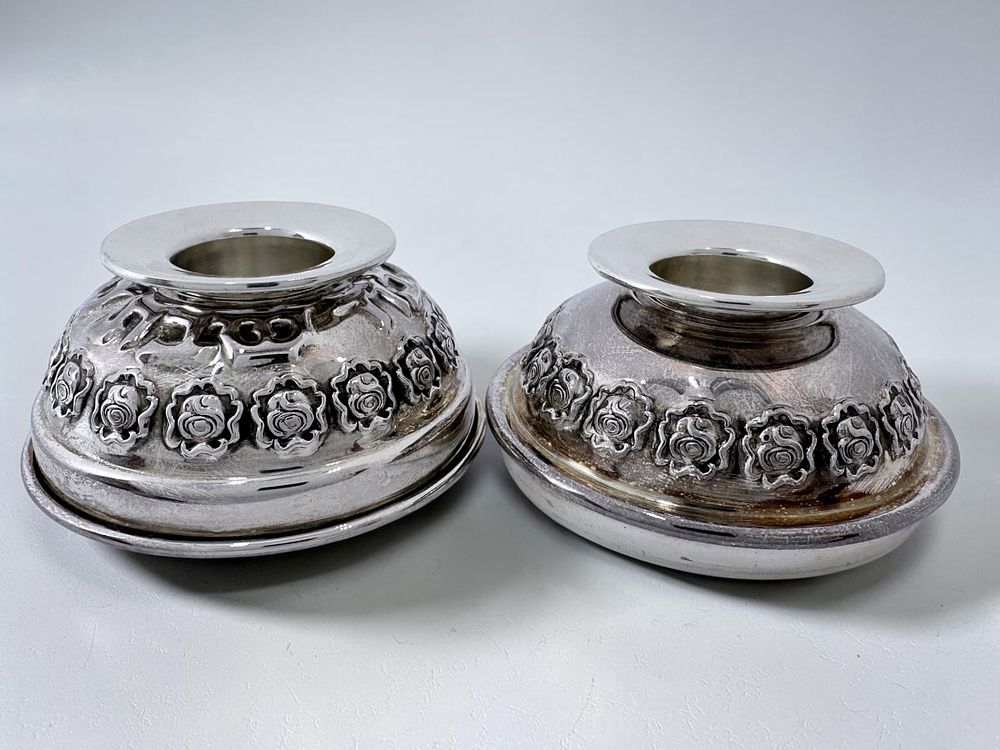 Silver travel candlestick holders by HaZorfim. Sterling 925 silver.
With embossed rose motif 