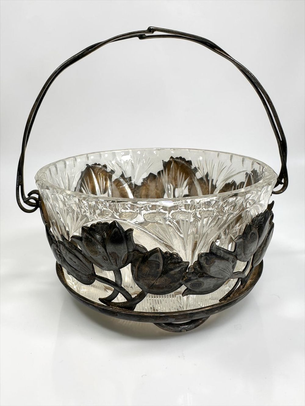 Beautiful candy dish made of cut crystal held by cut silver plated lily designed basket (with 
