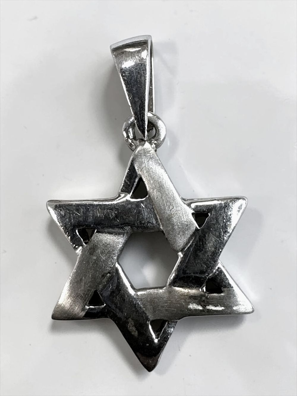 14k white gold star of David pendant. 
Hallmarked.