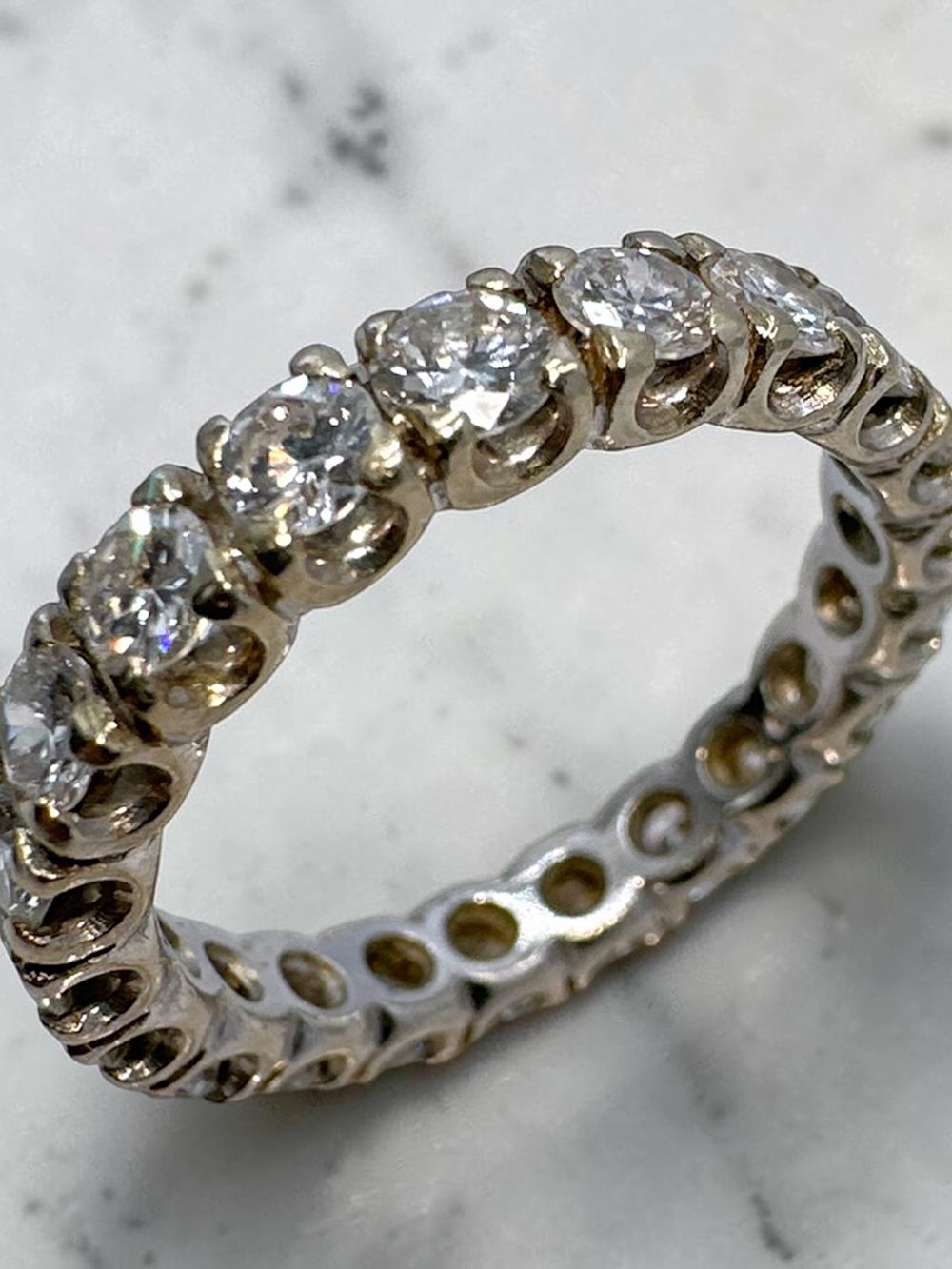 Diamond eternity band ring, made of 18k white gold and diamonds all around (1c worth). 