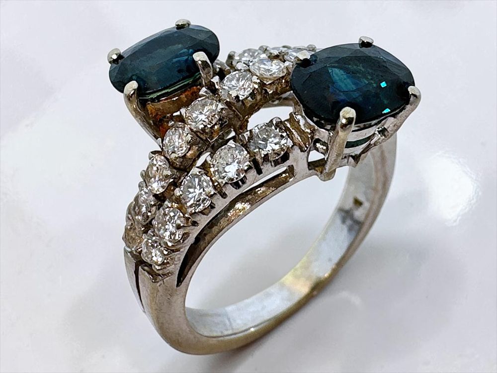 18k white gold ring, beautifully designed with 2 oval sapphire stones (each 1c) and 22 pave 