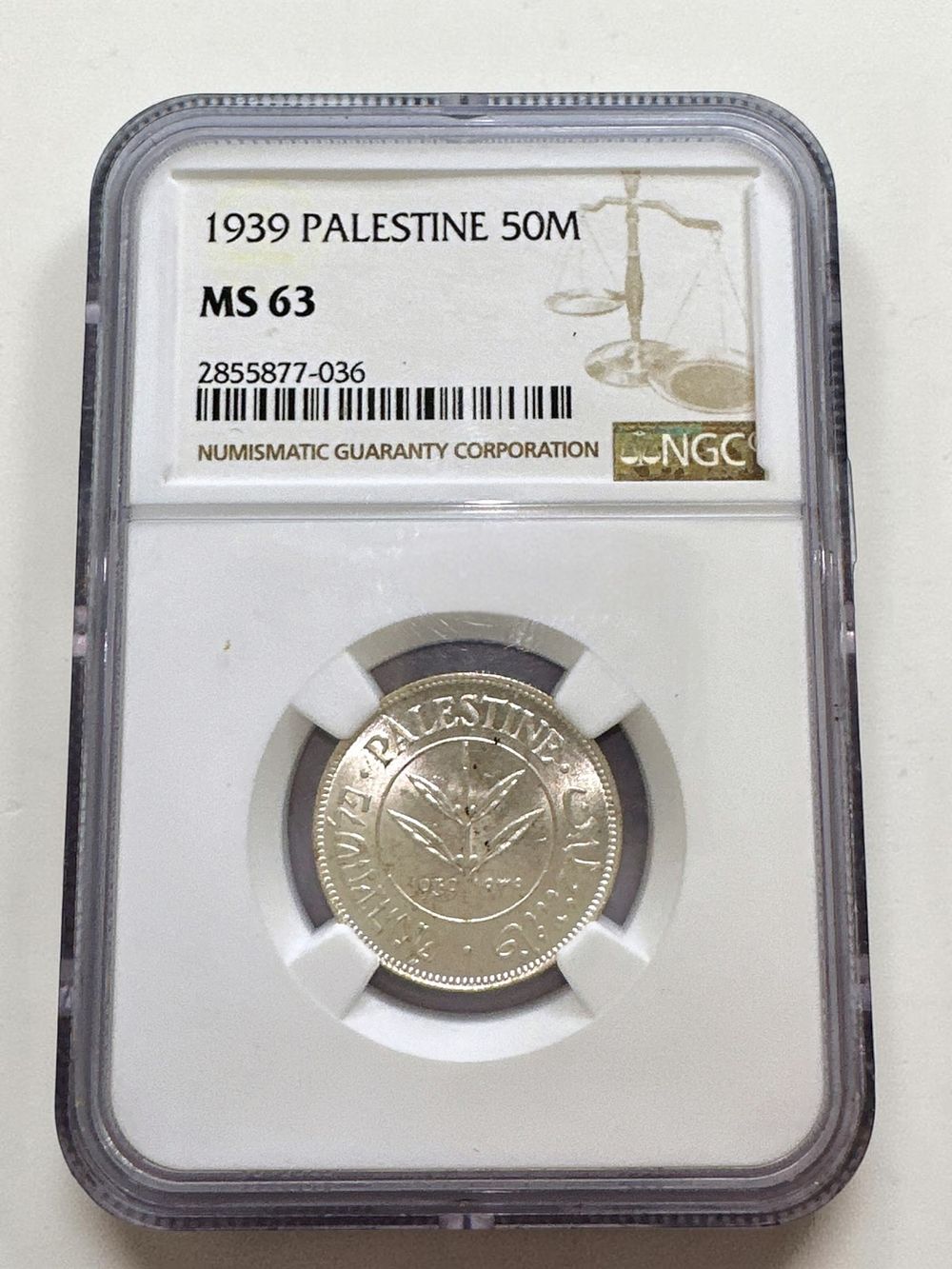 מטבע 50 מיל מנדט 1939, עשוי כסף 720 מדורג MS 63.