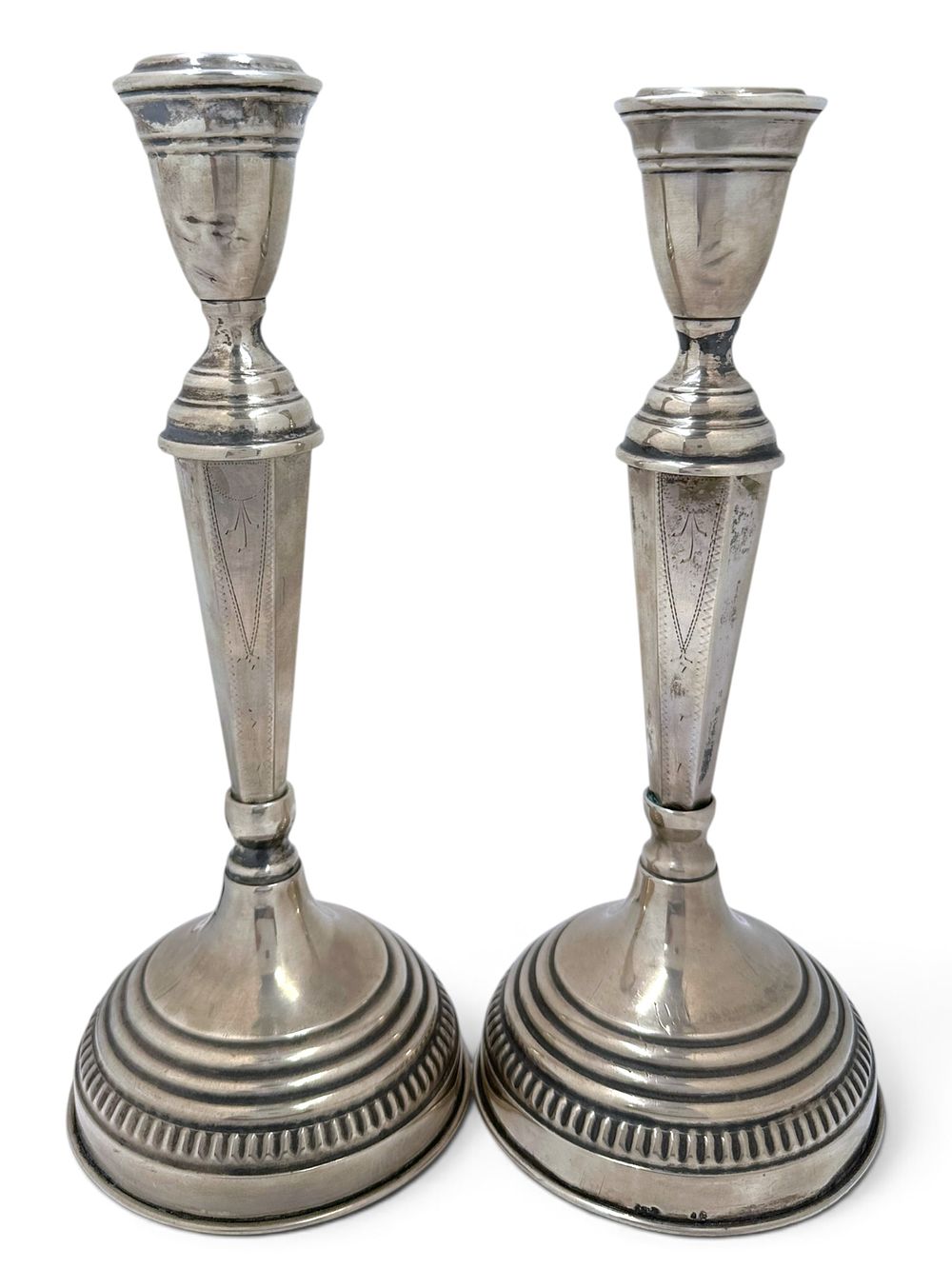 Antique European .800 silver candlesticks featuring shtichel engraving work. In good condition 