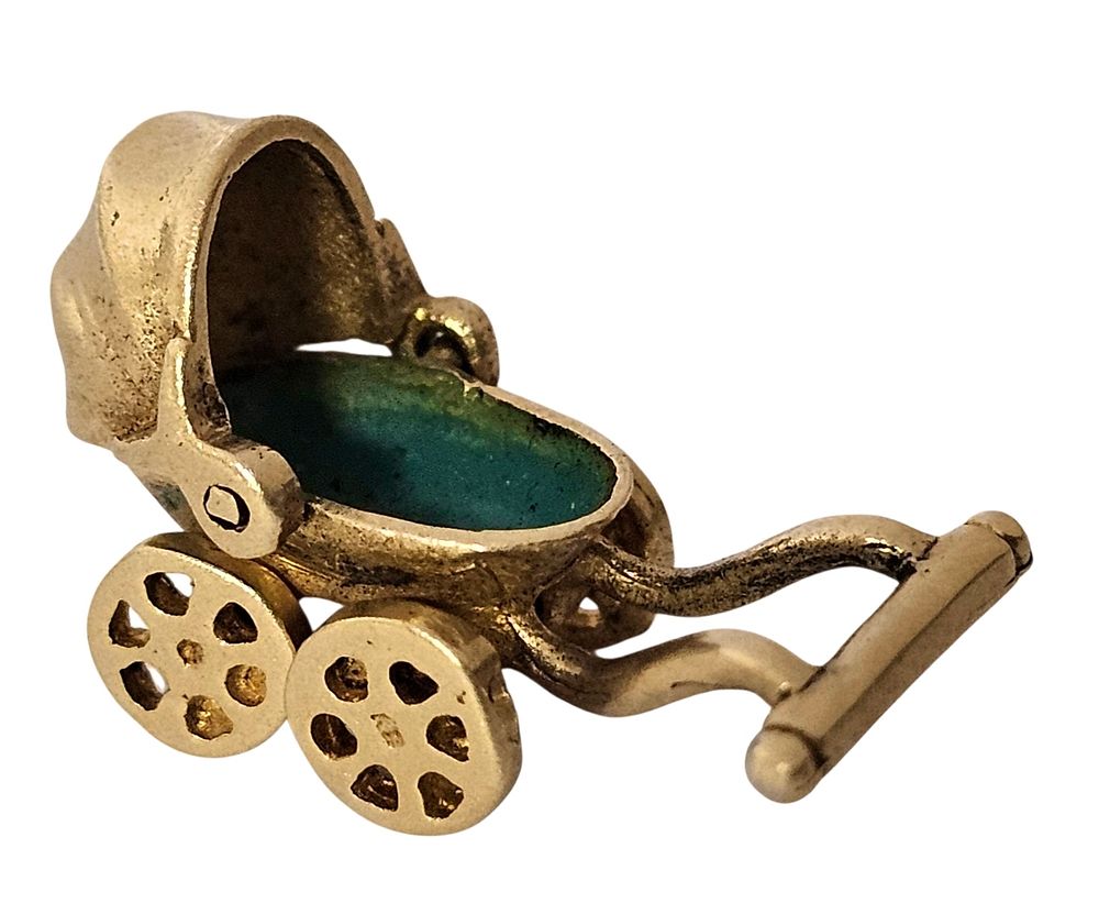 14k gold pendant in the design of a baby carriage, with the "bed" painted enamel in a jade 