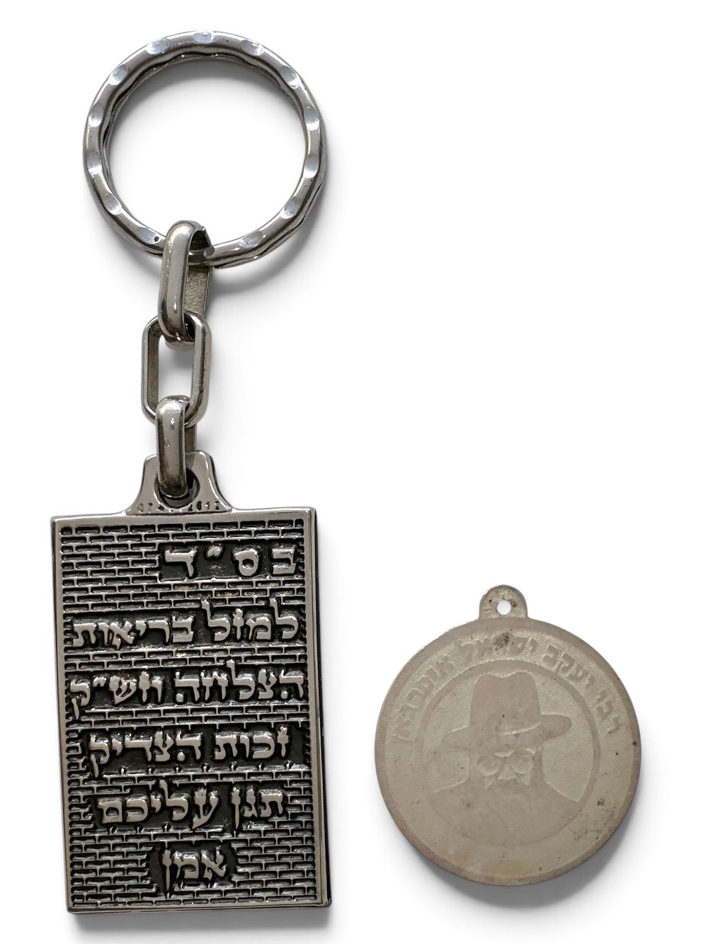 A pair of amulets gifted by Rabbi Yaakov Yisrael Ifargan: 925 silver pendant and a 