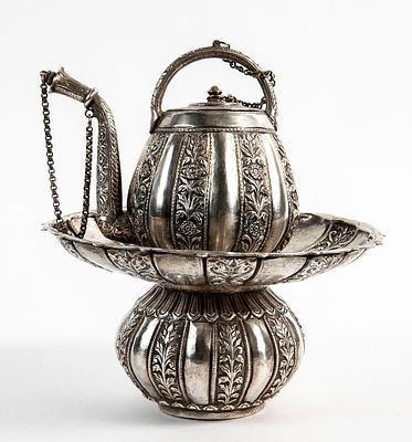 Antique Indian tea pot and matching base, from the late 19th century, made of silver and 