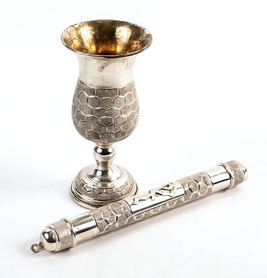 A matching set of a cup and a mezuzah, made of 925 silver, hallmarked, 
Gross weight: 255 grams 