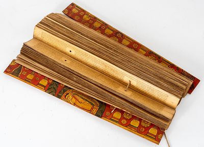 PALM LEAF MANUSCRIPT. Asia, palm leaves inscribed by hand between painted wooden covers 